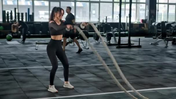 Young Female Athlete Trains Gym Ropes Crossfit Endurance — Vídeos de Stock