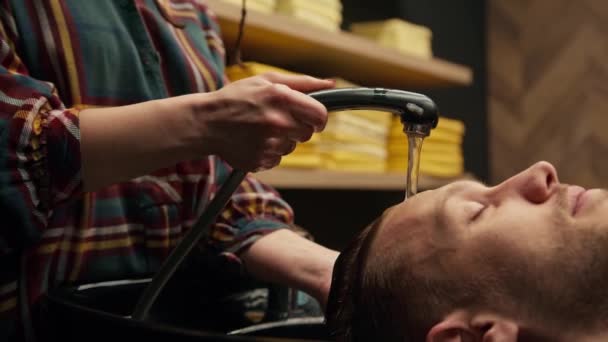 Barbershop Female Barber Washes Head Male Client — Stok video