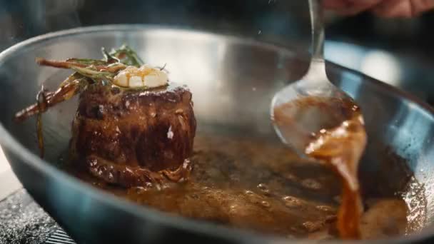 Close Chef Pouring Sauce Filet Mignon While Cooking — Stock video