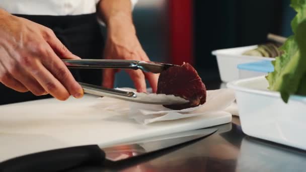 Close Chef Puts Raw Filet Mignon Frying Pan — 图库视频影像