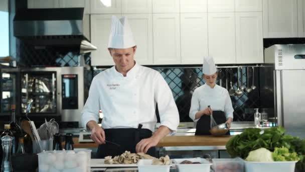 Restaurant Kitchen Portrait Male Female Chefs Preparing Dish Professionals Cooking — Vídeo de Stock