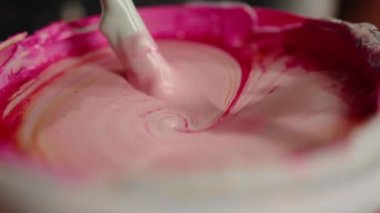 Close-up: paint is depicted with solvent in the workshop of an artist - sculptor