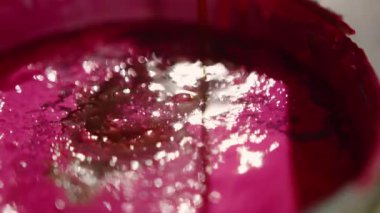 Close-up: paint is depicted with solvent in the workshop of an artist - sculptor