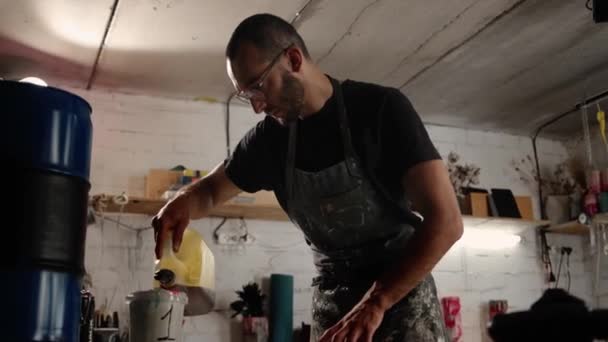 Male Worker Mixes Paint Sculptor Creates Solution His Future Work — Stock video