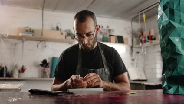Man Arab Appearance Sharpens Blade Workshop Sculptor Painter Needleworker — Vídeo de stock