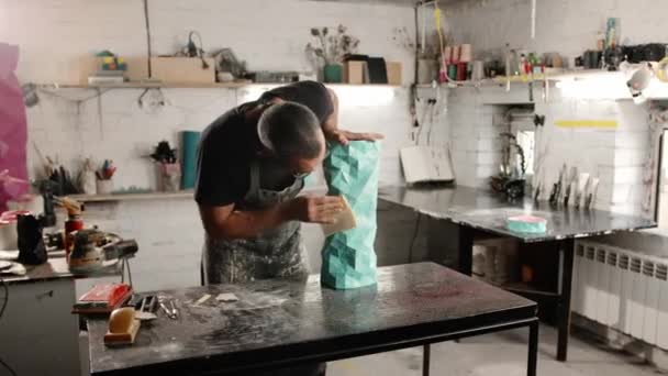 Male Artisan Artist Sculptor Wipes Product Puts Things Order Workshop — Stock Video
