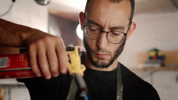 Male Craftsman Burns His Product Gas Burner Workshop — kuvapankkivideo