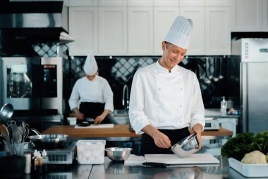 Professional restaurant kitchen: chefs prepare delicious dish