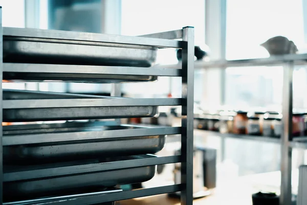 Interior professional restaurant kitchen, the rack with baking sheets