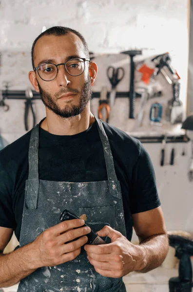 Male Worker Background Wall Tools Art Workshop Looks Camera Serious — Stok fotoğraf