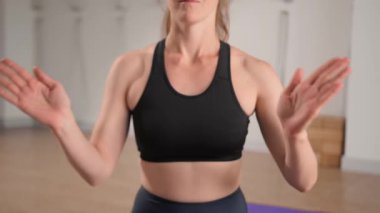 Close-up: girl doing yoga pilates stretching and meditating