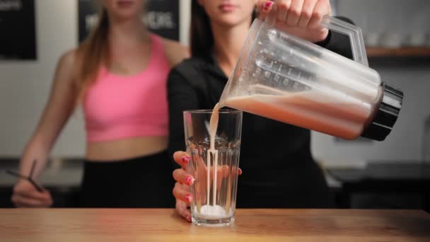 Close Two Girls Made Protein Shake Pour Glass — Stock Video