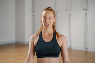 Close-up woman with funny face during yoga. she was skewed.
