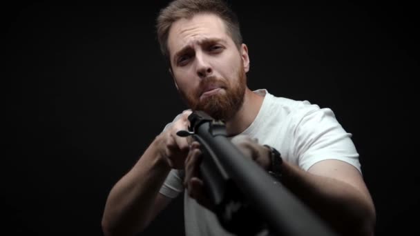 Close Man Holds Shotgun His Hands Aims Looks Camera — Stock video