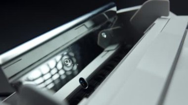 Money counting equipment for paper money calculation. Automatic mechanism bank financial operations. Currency exchange of one hundred usd. Closeup currency counting machine counting dollar bills