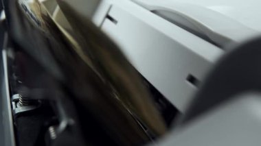 Money counting equipment for paper money calculation. Automatic mechanism bank financial operations. Currency exchange of one hundred usd. Closeup currency counting machine counting dollar bills