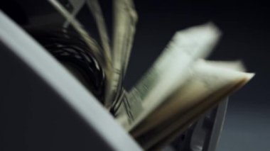 Money counting equipment for paper money calculation. Automatic mechanism bank financial operations. Currency exchange of one hundred usd. Closeup currency counting machine counting dollar bills