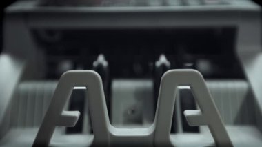 Money counting equipment for paper money calculation. Automatic mechanism bank financial operations. Currency exchange of one hundred usd. Closeup currency counting machine counting dollar bills