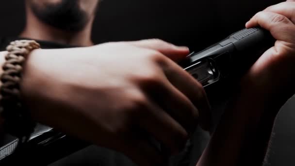 Close Man Black Shirt Black Background Loads Shotgun — Video Stock