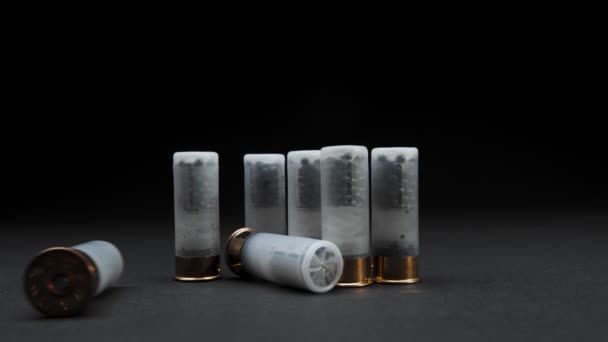 Close Shotgun Shells Table Dark Background One Cartridge Rolled Frame — Stock Video