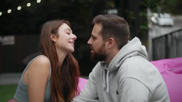 Couple Love Sits Ottoman Terrace Kisses Hugs — Vídeos de Stock