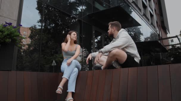 Attractive Man Listening Chatting Girl While Sitting Street — Stock videók