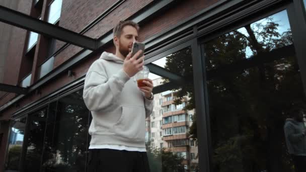 Attractive Young Man Beard Talking Phone Work Issue Drinking Coffee — Vídeo de stock