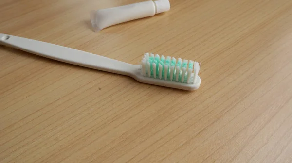 White Toothbrush Toothpaste Table — Stock Photo, Image