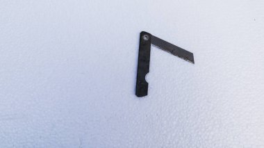 rusty razor blade on a white background