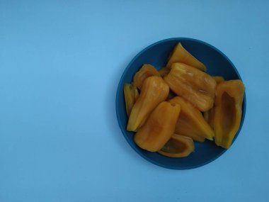 Papaya fruit in plastic container on white background