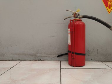 Fire extinguisher installed in the room