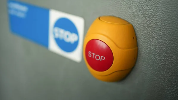 Stop button for passengers to indicate the intention of getting off