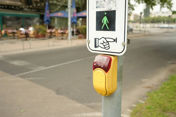 Press the button to cross the road