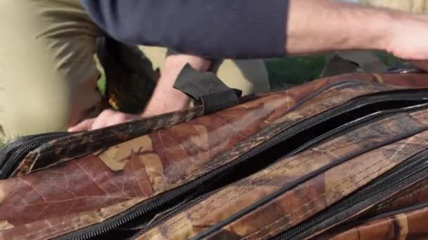 Angler Unzipping Zipping Back His Rod Holder Bag — Stock Video