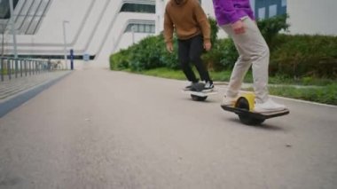 Midsection. Close up leg shot of a skaters with electric skateboard
