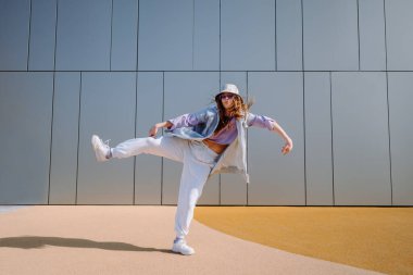 Dancing girl funny break dance, happy rhythmically waving. Playful crazy girl dance emotions. Breakdancing, street dancing, hiphop, freestyle dance.