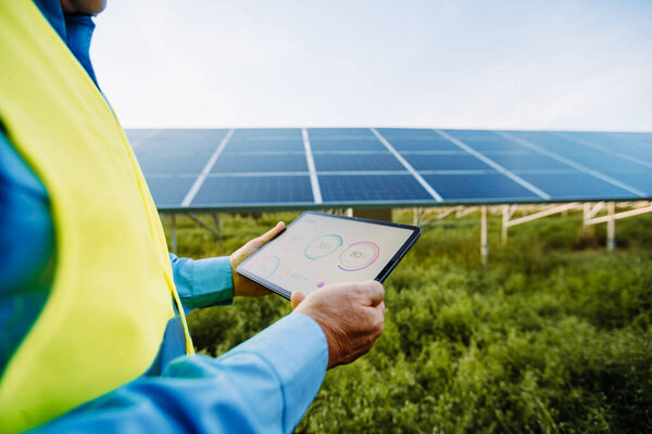 Worker Using Tablet Setting Solar System Eco Concept High Quality Stock Picture