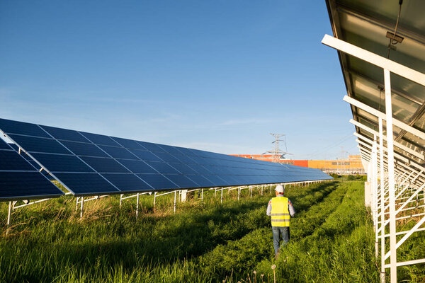 Worker Solar Farm Solar Photovoltaic Panels Solar Energy Eco Concept Royalty Free Stock Photos