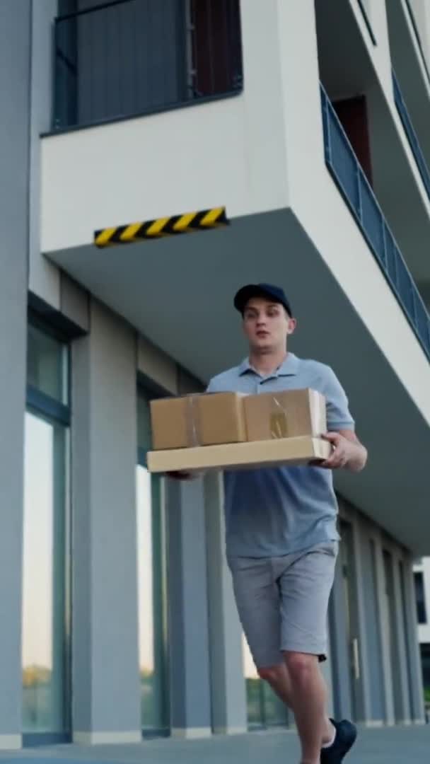 Clumsy Caucasian Delivery Man Falls Ground Drops Cardboard Boxes Young — Stockvideo