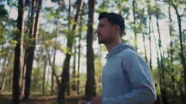Young Male Athlete Feeling Concentrated While Running Forest Smiling Healthy — Video