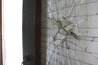 Broken glass in  window after shelling in Kharkiv during Russian bombardment. Kharkiv, March 2022