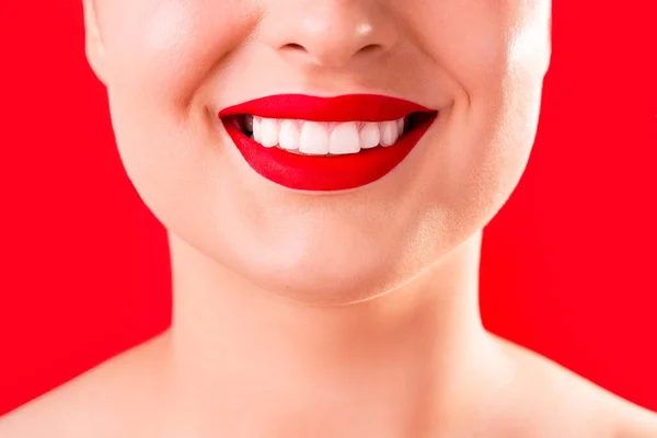 Teeth whitening. Healthy white smile close up. Beauty woman with perfect smile- lips and teeth. Beautiful Model Girl with red lips isolated on white background. Perfect ski