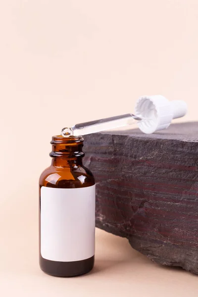 Unmarked Amber Glass Bottle Dropper Lid Beige Background Stone Mock —  Fotos de Stock