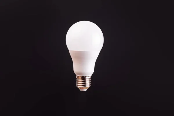 LED light bulbs on black color background. Levitation with copy space. Concept ecology, save planet earth, idea, save energy, economy, saving. Earth day