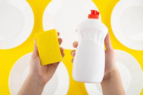 Cleaning Yellow Sponge Detergent Dishes Holding Hand Yellow Background White — Foto de Stock