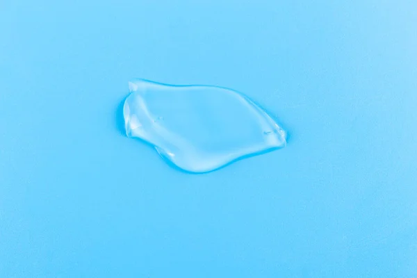 Moisturizing Transparent Face Cream Gel Smeared Isolated Blue Background — Zdjęcie stockowe
