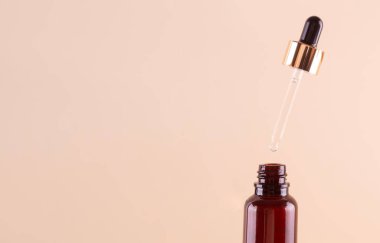 Levitation pipette with collagen moisturizing hyaluron clear serum  into the bottle. Aromatic cosmetic product for skin and hair care Moisturizing beauty product with organic