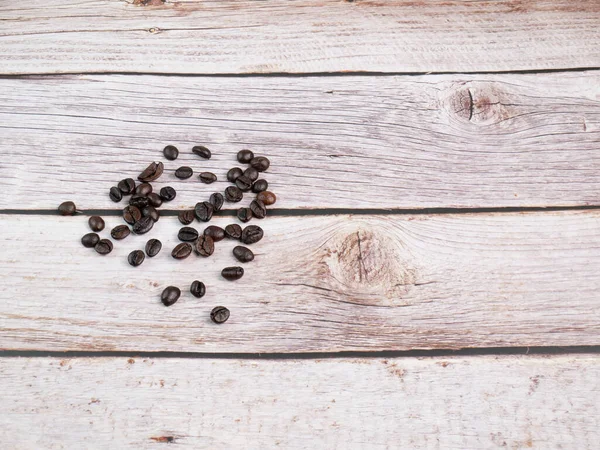 Close Shot Coffee Beans Loured Wooden Floor Focus Some Point — стоковое фото