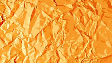 Turuncu kağıdın arka planı kırışmış, ışık ve gölgeden oluşan kaba bir doku oluşturuyor..
