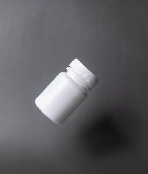 White Plastic Pill Bottle Unlabelled Capped Floating Black Background — Foto de Stock